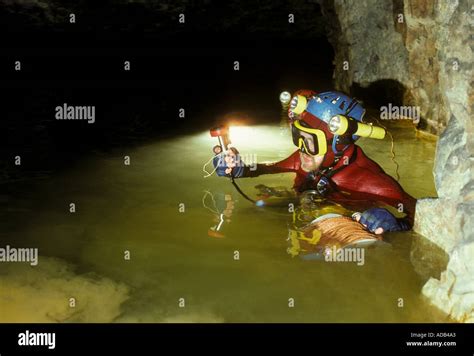Cave Diver With Line Reel In Sump Underwater Passage Wales Uk Stock