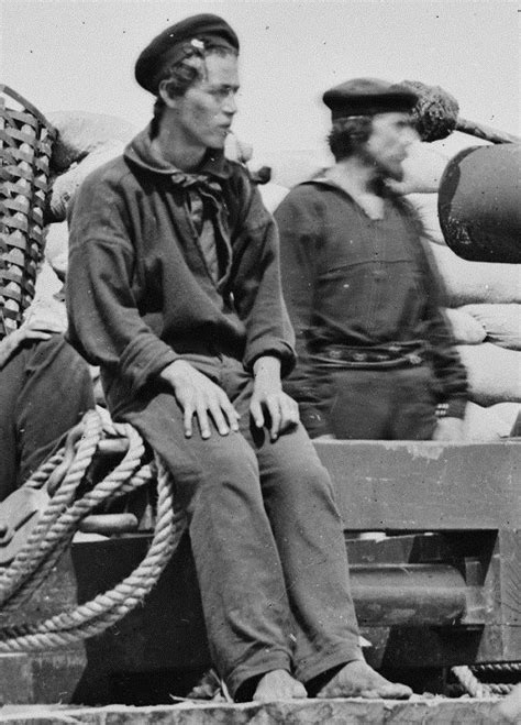 A Young Pipe Smoking Sailor Sitting Barefooted By A Cannon He And His