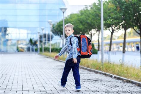 The Boy Goes To School With A Backpack The Concept Of Childhood