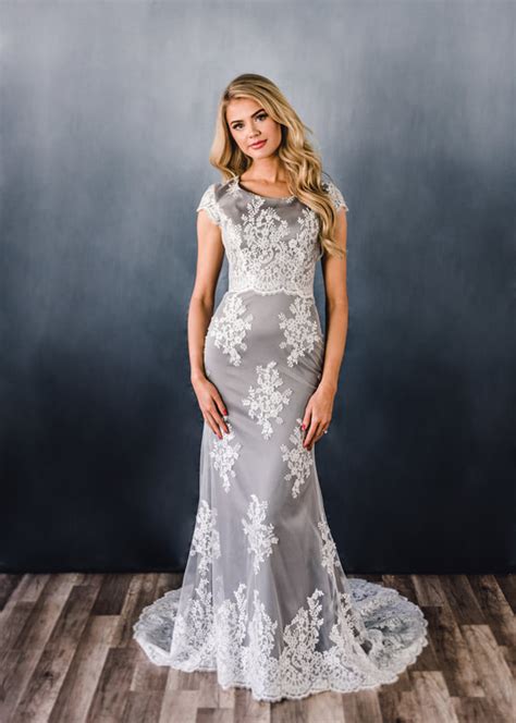 Joan Gown Features An All Over Lace Trumpet Silhouette With A Scoop