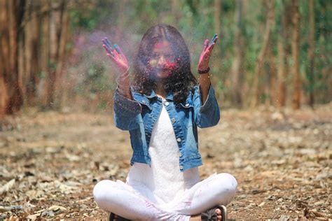 A Girl In A Jungle Playing With Holi Colors Pixahive