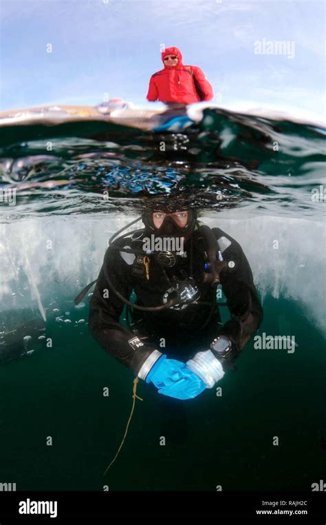 Diver Ice Diving In Lake Baikal Olkhon Island Siberia Russia Stock