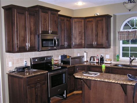 This leaves room for a contrasting hue in the cabinet hardware. Kitchen Cabinet Refacing in a Mediterranean Stain ...