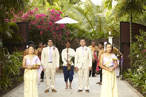 A flower chain connects the hands of the bride and groom as. A Destination Wedding in Koh Samui, Thailand - The ...