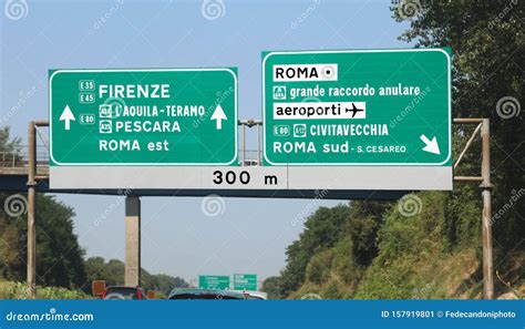 Italian Highway With The Road Sign With Directions To Udine And Royalty