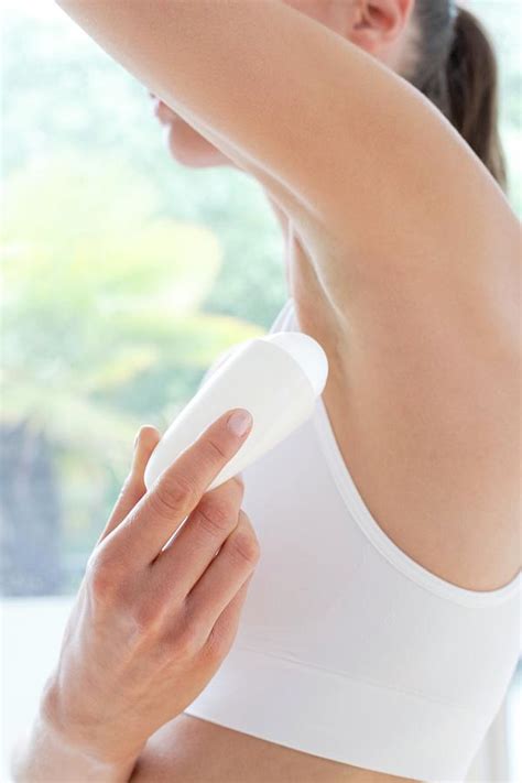 Woman Applying Underarm Deodorant Photograph By Ian Hootonscience