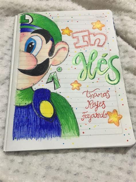 A Notebook With An Image Of Luigi From Marios World Is On The Cover