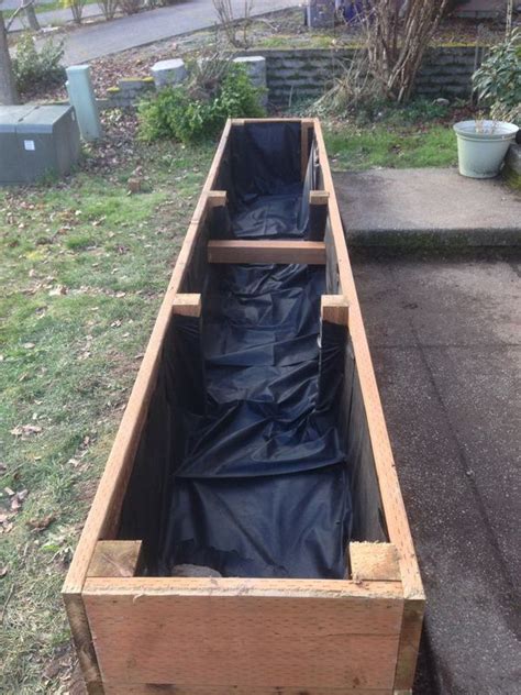 I built this obelisk using two sizes of lumber (2x2s and 1x2s). How To Build a Raised Planter Bed for under $50 For Your ...