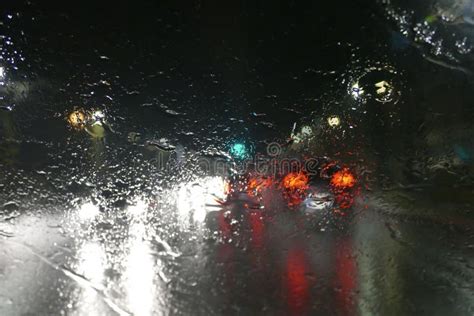 Road Traffic In Rainy Night With Cars And Lights Selective Focus On