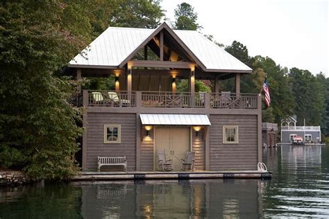 A House On The Water With A Boat In Its Front Yard And Deck