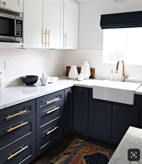 Maybe you would like to learn more about one of these? Black lowers, white uppers, quartz counter, tile ...