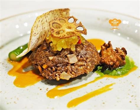 Italy is a nation known for its rich, flavorful cuisine. Vegetarian Fine Dining at Sampling on the Fourteen - Berjaya Times Square Hotel.Cubes of yam are ...