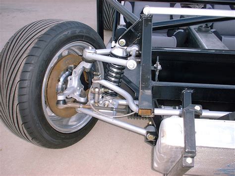 The body rides on a tubular. Front Suspension - A&E Automotive & Machining
