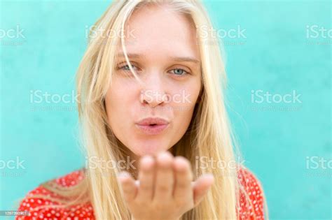 Beautiful Female Model Blowing A Kiss To The Camera Stock Photo