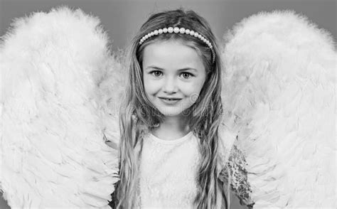 Wonderful Blonde Little Girl In The Image Of An Angel With White Wings