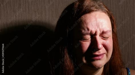 Woman Hysterically Cry In Dark Room Closeup Tears Rolling Down Cheeks