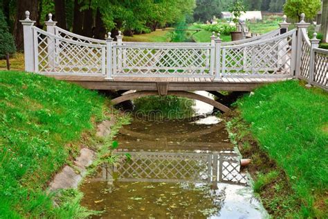 Wooden Bridge Over A Small River In The Park Stock Image Image Of