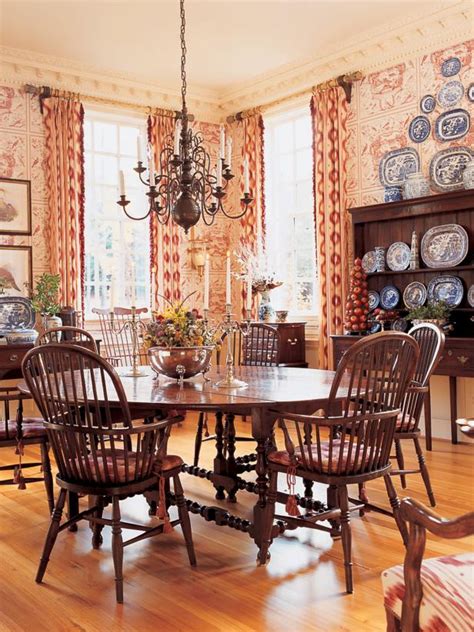 An elegant toile de jouy wallpaper in a with urns and cherubs in browns on aqua blue. French Country Dining Room With Toile Wallpaper | HGTV