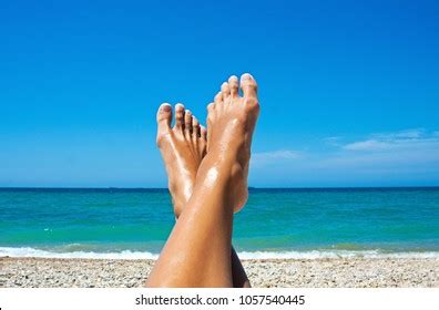 Woman Tanned Legs On Sand Beach Stock Photo Edit Now