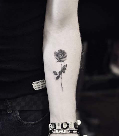 Fine Line Rose Tattoo On The Left Inner Forearm