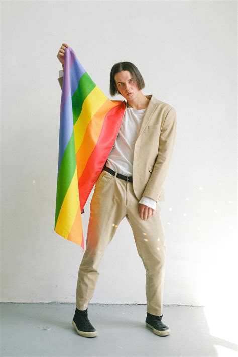 Man Holding A Gay Pride Flag · Free Stock Photo