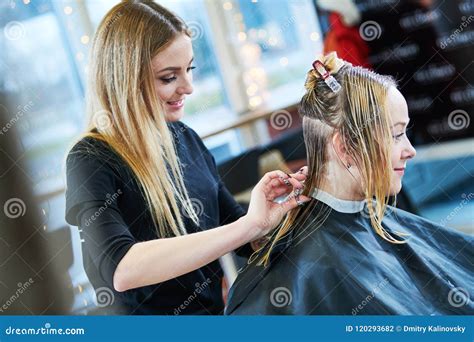 Barber Or Stylist At Work Hairdresser Cutting Woman Hair Stock Photo