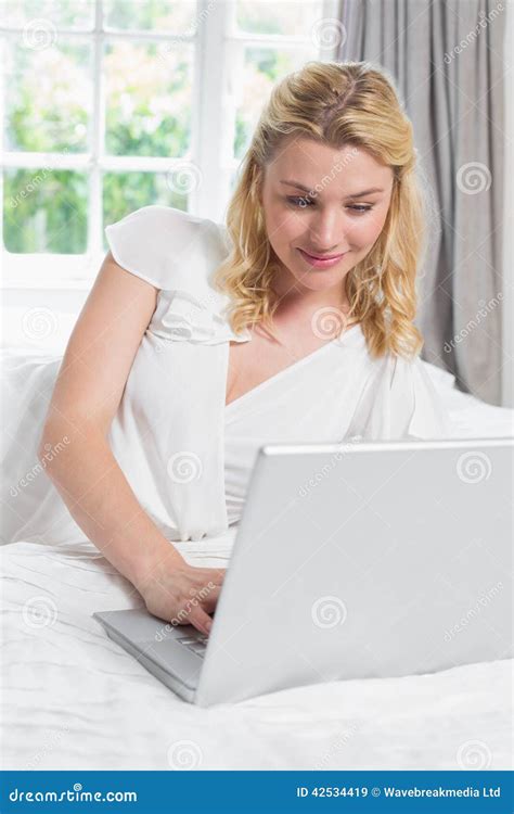 Pretty Blonde Lying On Bed Using Laptop Stock Image Image Of Life