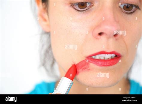 Red Lips Woman Sad After Painting Her Face By Accident Stock Photo Alamy