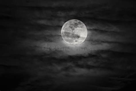 Full Moon Shining Brightly Through Dark Clouds Black Sky Stock Photo
