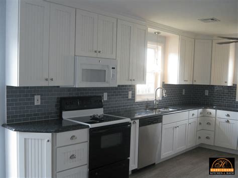 Add crown molding to kitchen cabinets for an updated look. Retrofitting Kitchen for Over-the-Range Microwave