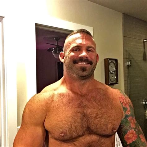 A Shirtless Man Is Taking A Selfie In Front Of The Bathroom Mirror With
