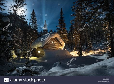Small Cottage In A Beautiful Snow Forest At Moon Night