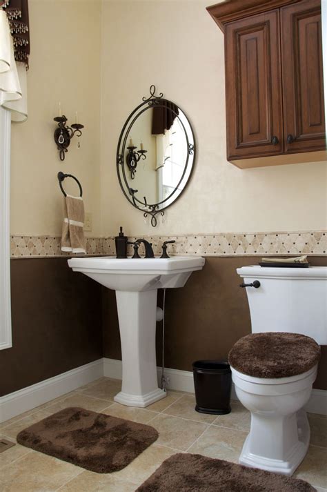 A powder room vanity with transitional cabinet styling like shaker style cabinet doors, mullion accents and tapered legs will work both in older homes and newer ones. Elegant powder room done by All About Interiors ...