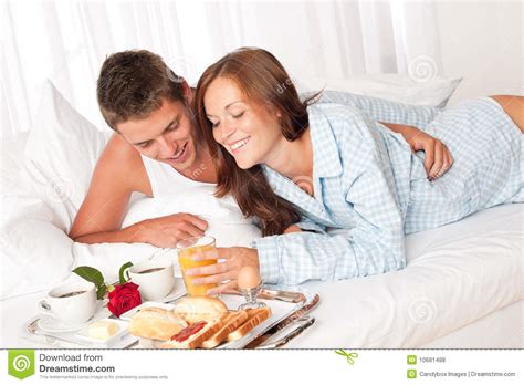 Happy Couple Having Breakfast In Bed Royalty Free Stock