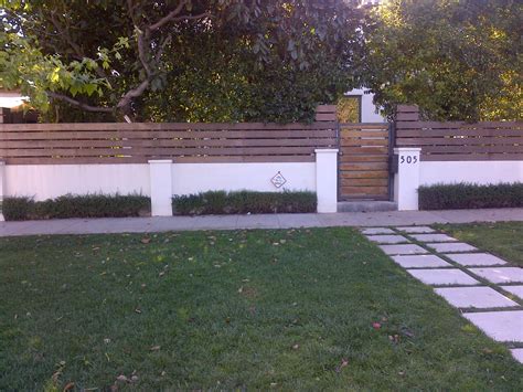 Wood And Stucco Wall Tropical Landscaping Driveway Landscaping