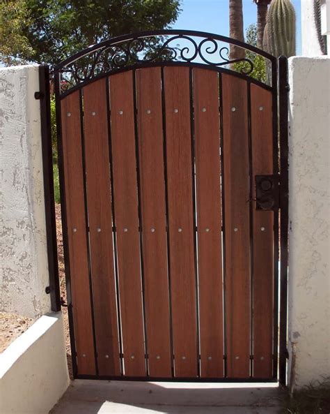 See how i built a 12 foot wooden gate that won't sag. Iron & Wood Gate Examples | Sun King Fencing & Gates