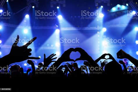 Crowd Of Cheering Fans During A Live Concert Stock Photo Download