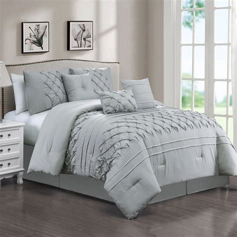 The set usually includes everything from pillow covers to bed skirts and shams with complimenting looks. Pintuck Microfiber Light Grey Queen Comforter Set | At Home