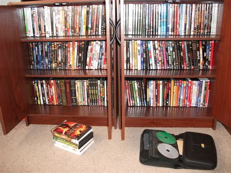 Keep your multimedia collection neatly behind closed doors with the grand locking media storage cabinet with shaker doors. SK Studios Homemaking: dvd storage