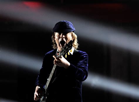 Angus young has gone from rock star to crock star at the french open. Happy Birthday, Angus Young!