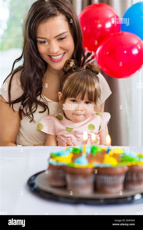 Mother With Daughter Celebrating Birthday Party Stock Photo Alamy