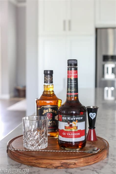Old fashioned glass half filled with ice. An EASY Old Fashioned for Virtual Happy Hour - Viva Veltoro