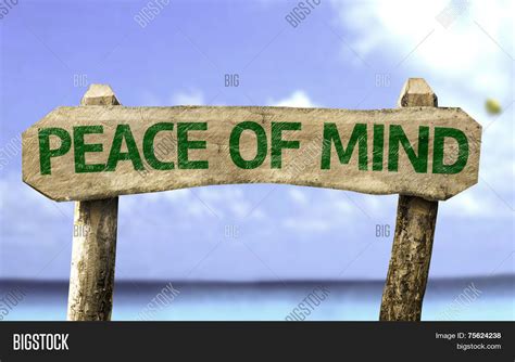 Peace Of Mind Wooden Sign With A Beach On Background Stock Photo