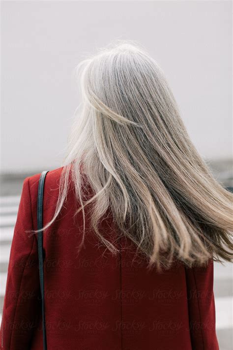 Back View Of Mature Woman With Grey Long Hair In The City Stocksy United