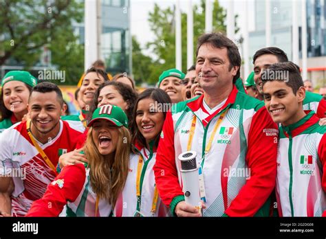 Mexican Athletes In Joyful Mood Posing For Photograph Holding The Pan