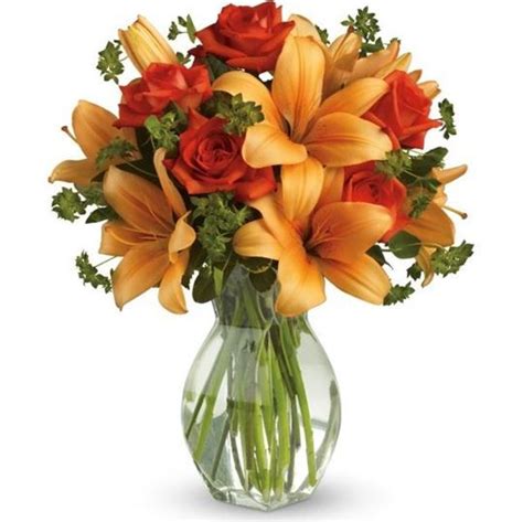 Dark Orange Roses And Asiatic Lilies Are Mixed With Fresh Green