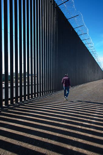 Calexico Ca Man Walks Past New Usmexico Border Barrier Stock Photo