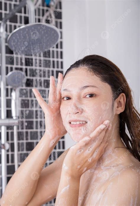 woman washing face in shower foaming in the bathroom photo background and picture for free