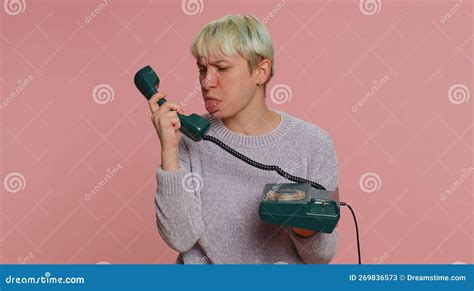 Crazy Millennial Woman Talking On Wired Vintage Telephone Of 80s