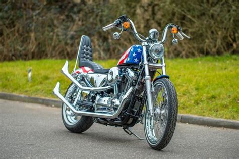 With the very recent passing of film maker, bike builder and social activist cliff vaughs, we feature the captain america motorcycle this week. The Legend of Harley Davidson Sportster: Captain America 72